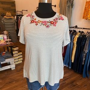 Striped top with embroidered neck.